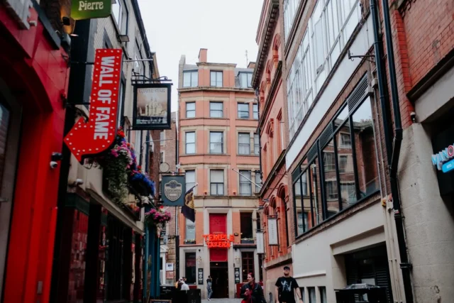 Who’s been to or recognises any of these places around Liverpool? 👀

One of them is looking very different from its usual lively self... (I’m looking at you, Matthew Street!)

This is why I love taking my camera out on my daily walks. It’s never about hunting for the “perfect” photo. It’s about noticing the little things that make a place feel alive.

A colourful café I’ve added to my “must visit” list and always walk past…An art gallery that feels welcoming before you’ve even stepped inside. A record shop that’s making me seriously consider buying a record player... if you’ve got one, tell me... does the sound really live up to the hype, or do you just love the whole experience? 🎶

A stroll past Charlotte Tilbury home of my trusty foundation, walking past the Capitol Building on Old Hall Street, and dreaming about treating myself to some flowers from Arta’s Flowers one day. They always make me smile when I pass.

Then the little moments like spotting the football fever because England are playing. A couple walking hand in hand…The lines of the buildings. The shapes. The quiet pockets that somehow exist in the middle of a busy city.

Photography has taught me that there’s always more to notice than we first realise. Sometimes all it takes is slowing down for a second.

I’d genuinely love to know... which photo is your favourite, and have you been to any of these places? 🤍

The world is already so beautiful. We just forget to notice.

#SarahGlynnPhotography #LiverpoolLife #StreetPhotography #LoveLiverpool